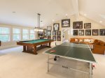 Ping pong table and pool table in the game room.